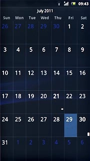 Go to month view (see above).Slide you finger up or down on the display to select the required month.