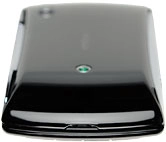 Turn the back of your phone towards you.Take hold of the top of the back cover and remove it.