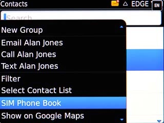 Scroll to SIM Phone Book and press the Navigation key.