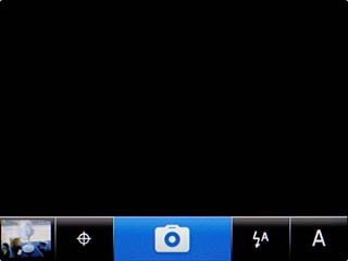 Scroll to the camera icon and press the Navigation key to take the picture.