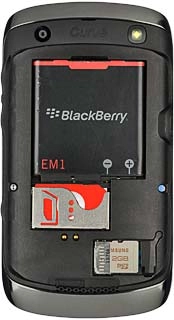 Take hold of the top of the battery and remove it.