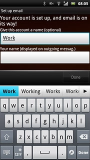 Press the field below Your name (displayed on outgoing messag.) and key in the required sender name.