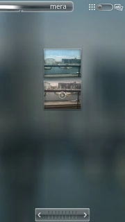 Go to the required folder.Press and hold the required picture or the required video clip to select it.