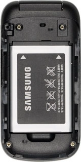 Take hold of the bottom of the battery and remove it.