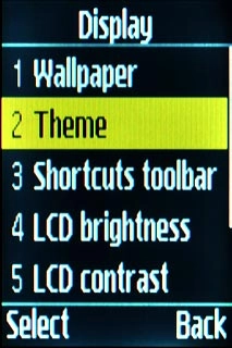 Scroll to Theme and press the Navigation key.