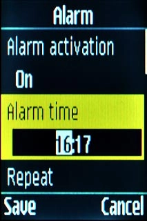 Scroll to Alarm time and press the Navigation key.Key in the required time.