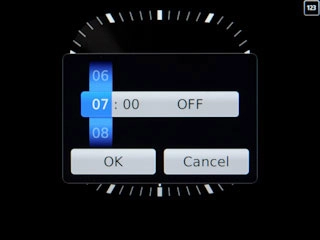 Slide hours and minutes up or down to set the time for the alarm.