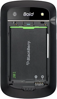 Take hold of the top of the battery and remove it.