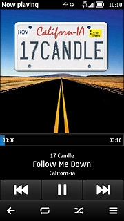 To go to the previous audio file:Press arrow left twice.