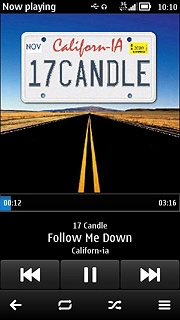 To fast forward or rewind the current audio file:Press and hold arrow right or arrow left.