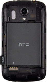 Turn the back of the phone towards you.Turn the memory card so the contacts on the card are facing downwards.Slide the memory card into the holder.