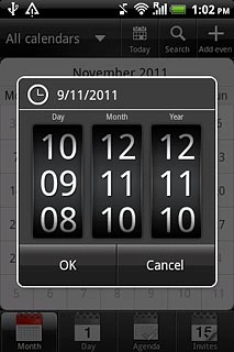 Slide the numbers up or down to select the date.