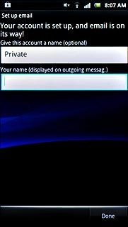 Press the field below Your name (displayed on outgoing messag.) and key in the required sender name.