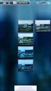 Go to the required folder.Press and hold the required picture or the required video clip to select it.