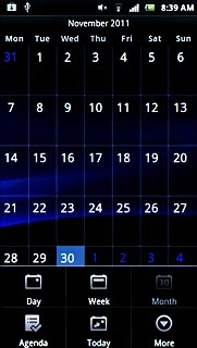 Go to month view (see above).Slide you finger up or down on the display to select the required month.