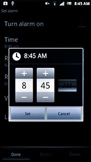 Press + or - next to hours and minutes to set the time.