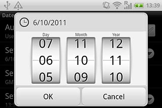 Slide the numbers up or down to set the date.