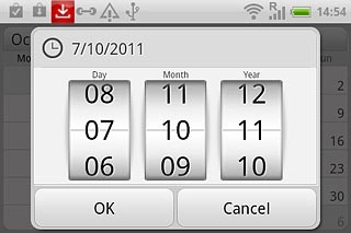 Slide the numbers up or down to select the date.