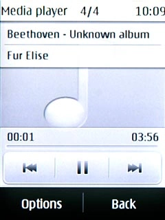 To go to the previous audio file:Press double arrow left.