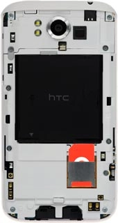 Take hold of the top of the battery and remove it.