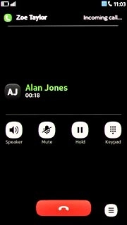 When you have an ongoing call, the new call is signalled by a sound.Press  at the top of the display.