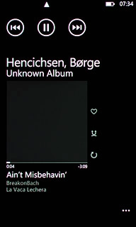 To fast forward or rewind the current audio file:Press and hold arrow right or arrow left.