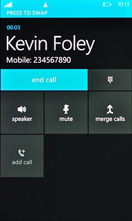 Press PRESS TO SWAP to swap calls.