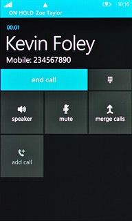 Make sure the call you want to end is active.Press end call.The active call is ended and the call on hold is automatically activated.