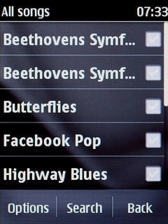 Go to the required audio file.Press the required audio file to tick it.