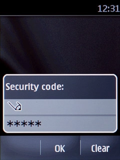 Key in the current phone lock code (default is 12345) and press OK.