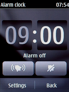 Key in the time for the alarm and press Settings.