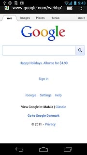 Press the address bar at the top of the display.