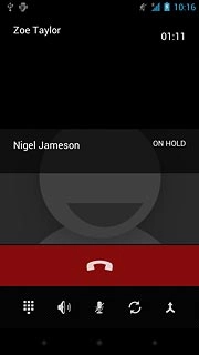 Make sure the call you want to end is active.Press the end call icon.The active call is ended and the call on hold is automatically activated.