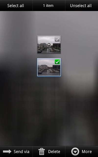 When a picture or video clip is ticked (V), it's selected.
