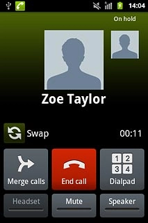 Your calls are displayed at the top of the display and the call on hold is indicated by On hold .