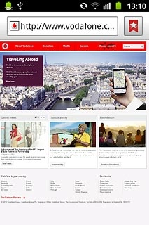 Press the address bar at the top of the display.