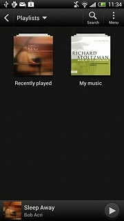 Press the drop down list at the top of the display.Go to the required audio file or playlist.