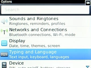 Scroll to Typing and Language and press the Navigation key.