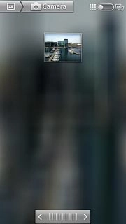 Go to the required folder.Press and hold the required picture or the required video clip to select it.