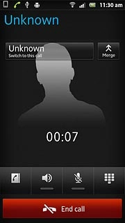 The active call is displayed at the centre of the display.Press Switch to this call to turn on the call on hold.