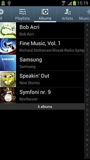 Press the required category at the top of the display.Go to the required audio file or playlist.