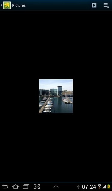 Go to the required folder.Press and hold the required picture or the required video clip to highlight it.