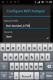 Press the field below Network SSID and key in the required name for the Wi-Fi hotspot.