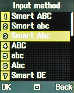 Highlight Smart Abc, Smart De or Smart Nl and press the Navigation key.