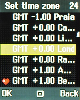 Highlight the required time zone and press the Navigation key.