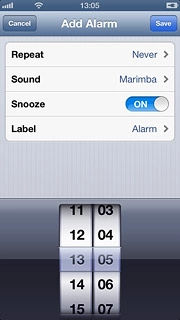 Drag the wheels to set the time for the alarm.