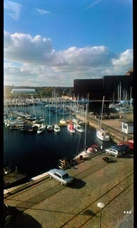 Press the dots in the bottom right corner of the display.