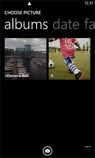 To take a new picture:Press the camera icon.
