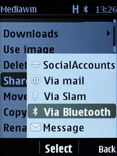 Scroll to Via Bluetooth and press the Navigation key.