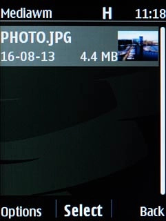 Go to the required folder.Highlight the required picture and press the Navigation key.